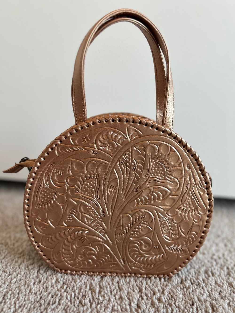 Kuriosa Metallic Rose Gold Round Crossbody Bag